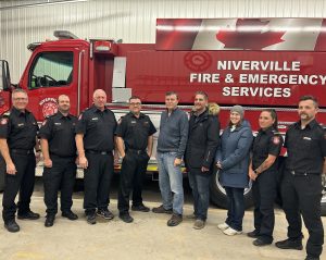 Image of Council and Fire Department standing in front of new water tanker.